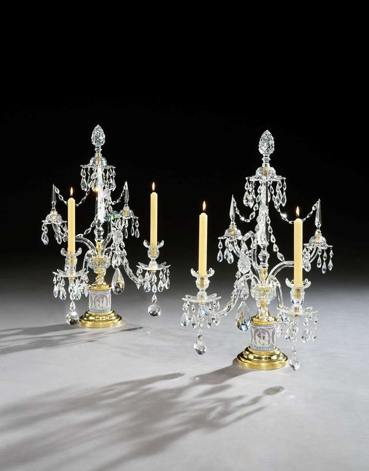 A pair of ormolu mounted cut glass and tricolour jasper two light candelabra